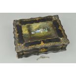 A VICTORIAN PAPIER MACHE WORK BOX, of wavy rectangular outline, the hinged cover painted and