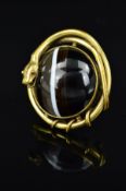 A LATE VICTORIAN GOLD PLATED BANDED AGATE SNAKE BROOCH, the circular banded agate cabochon within