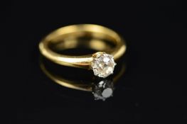 A SINGLE STONE DIAMOND RING, the old cut diamond within an eight claw setting to the plain band,