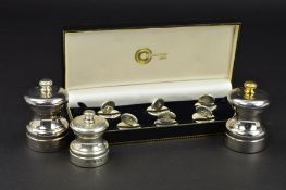 A CASED SET OF SIX ELIZABETH II SILVER PLACE NAME HOLDERS, of ovals on circular bases, the ovals