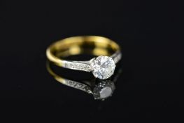 A MID 20TH CENTURY DIAMOND SINGLE STONE RING, with diamond set shoulders, centring on a principle