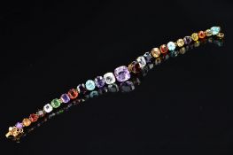 A MID 20TH CENTURY GOLD MULTI GEMSTONE BRACELET, assorted oval and cushion cut gemstones to