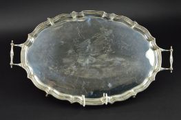 A GEORGE V SILVER TWIN HANDLED OVAL TRAY, pie crust border, engraved initial 'S' to centre, on