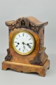 A VICTORIAN BURR WALNUT CUCKOO MANTEL CLOCK, applied foliate carving to the domed top and scrolled
