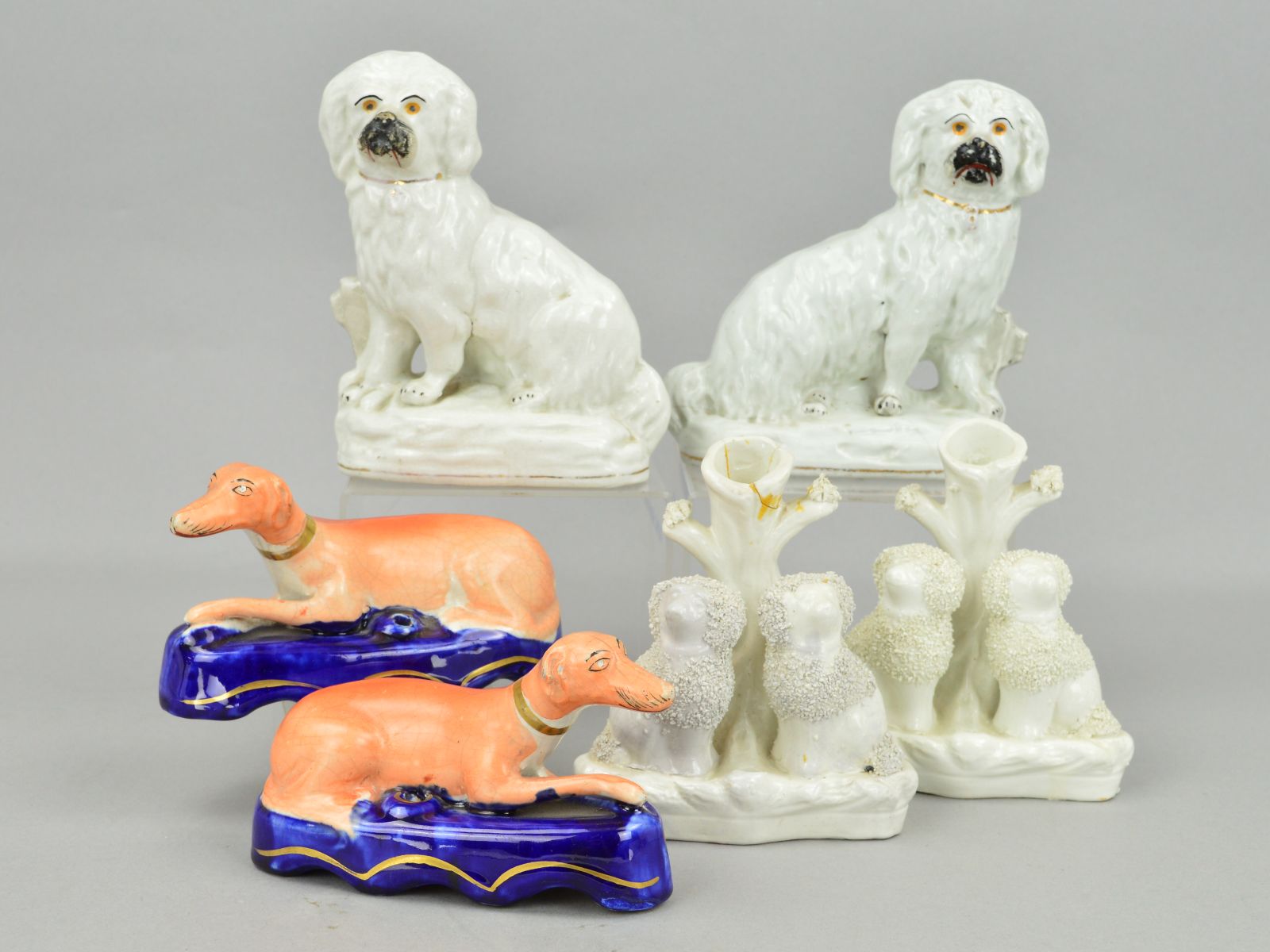 A PAIR OF VICTORIAN STAFFORDSHIRE POTTERY FIGURES OF SEATED DOGS, modelled with fences behind, on - Image 3 of 3