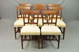 A SET OF EIGHT EARLY 19TH CENTURY MAHOGANY AND EBONY STRUNG DINING CHAIRS, the bar back with