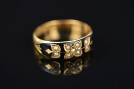A LATE VICTORIAN 15CT GOLD ENAMEL AND SPLIT PEARL RING, the tapered band set with split pearls in