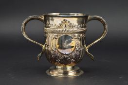 A GEORGE III SILVER TWIN HANDLED CUP, repousse and punched decoration including half gadrooning,