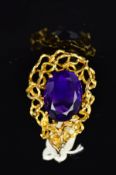 A 9CT GOLD MID TO LATE 20TH CENTURY LARGE FANCY AMETHYST PENDANT, centring on a deep purple colour