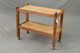 ROBERT 'MOUSEMAN' THOMPSON, an oak two tier tea trolley, on orbit castors, width 85cm x depth 39cm x