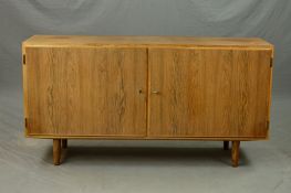POUL HUNDEVAD, DENMARK, a Rosewood two door sideboard with a birch lined interior, both doors