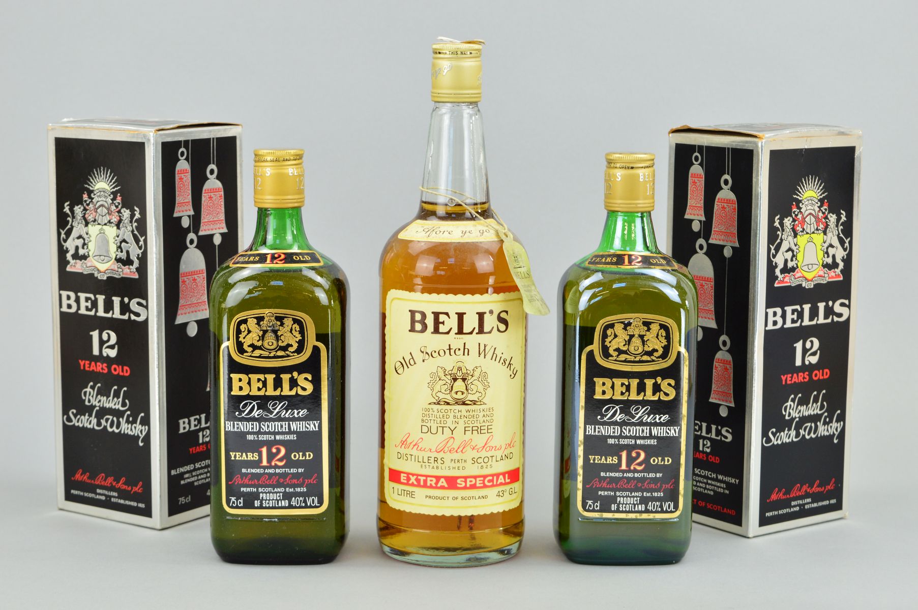 TWO BOTTLES OF BELL'S DE LUXE, aged 12 years, blended Scotch Whisky, 40% vol, 75cl, fill levels