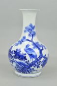 A CHINESE PORCELAIN BLUE AND WHITE BALUSTER VASE, decorated with an eagle perched in the branch of a