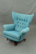 A G-PLAN MODEL 6250 1970'S SWIVEL BLOWFELD CHAIR, on a rosewood base, upholstered in pale blue