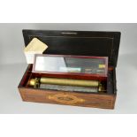 A LATE 19TH CENTURY ROSEWOOD AND INLAID CASED MUSIC BOX, the hinged lid cover with musical