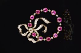 A LATE 19TH CENTURY GOLD RUBY AND DIAMOND BOW BROOCH, the Old European and Old Swiss cut diamond set
