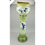A BURMANTOFTS FAIENCE JARDINERE AND STAND, shape No.2050B, moulded in relief with blue poppies on
