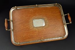 A GEORGE V SILVER MOUNTED OAK RECTANGULAR TWIN HANDLED TRAY, open gallery, engraved presentation
