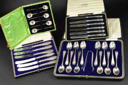 A SET OF TWELVE GEORGE V SILVER TEASPOONS AND MATCHING SUGAR TONGS, cased, engraved decoration and