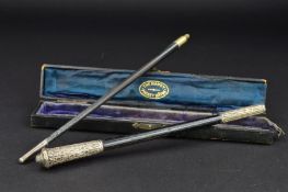 A CASED GEORGE V 'THE HANDY POCKET BATON', ebony with chased silver mounts, two sections with