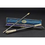 A CASED GEORGE V 'THE HANDY POCKET BATON', ebony with chased silver mounts, two sections with