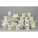 A COLLECTION OF VICTORIAN BONE CHINA JUGS, LOVING CUPS AND MUGS, etc, many painted with flowers