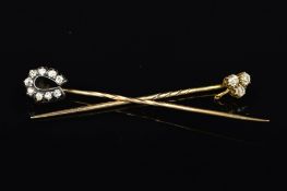 TWO DIAMOND STICKPINS, the first designed as a trefoil, claw set with three old cut diamonds,