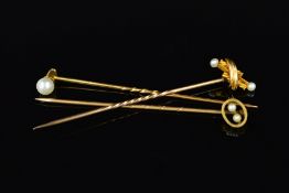 THREE PEARL STICKPINS, the first designed as a single pearl which unscrews from the pin head, the