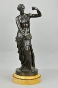 A LATE 19TH CENTURY PATINATED HOLLOW CAST BRONZE 'VENUS DE MILO', bears a plaque to the circular