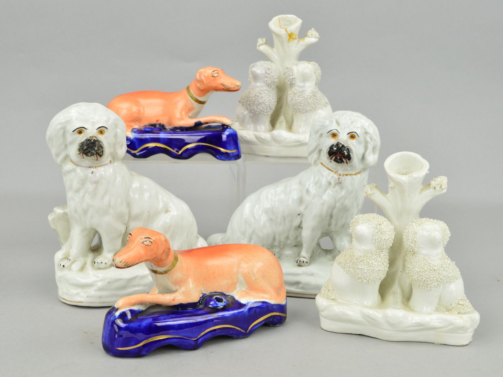 A PAIR OF VICTORIAN STAFFORDSHIRE POTTERY FIGURES OF SEATED DOGS, modelled with fences behind, on - Image 2 of 3