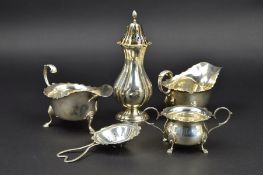 A PAIR OF ELIZABETH II SILVER SAUCE BOATS, wavy rims, foliate cast 'S' scroll handles, on three