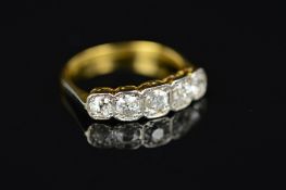 A GOLD EARLY 20TH CENTURY DIAMOND HALF HOOP RING, five Old European cut diamonds graduating in size,