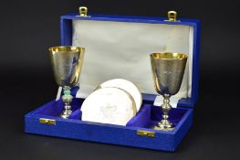 AN ELIZABETH II CASED SALLOWAYS LICHFIELD CATHEDRAL ANNIVERSARY GOBLET AND COASTER SET, limited