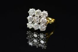 A MODERN SQUARE DIAMOND CLUSTER RING, comprising of nine modern round brilliant cut diamonds,
