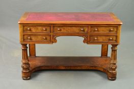 A VICTORIAN WALNUT WRITING DESK, the rectangular top with red leather writing surface inset, moulded