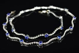 A MODERN 18CT WHITE GOLD DIAMOND AND SAPPHIRE WAVE LINK DESIGN COLLAR, measuring approximately 400mm