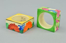 CLARICE CLIFF, two napkin rings, blue Chintz and Gay Day, hand painted at The Newport Pottery