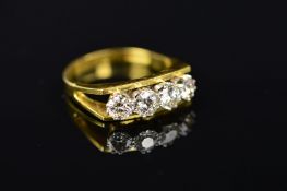 AN 18CT GOLD MODERN FOUR STONE DIAMOND HALF HOOP STYLE RING, four modern round brilliant cut