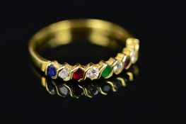 AN 18CT GOLD LATE 20TH CENTURY MULTI-GEMSTONE HALF ETERNITY RING, comprised of sapphires,