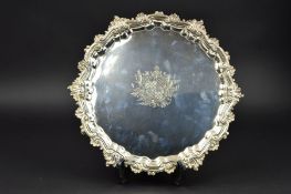 A GEORGE II SILVER SALVER, of circular form, foliate cast and pie crust border, armorial engraved to