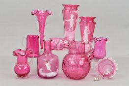 TEN PIECES OF VICTORIAN CRANBERRY GLASS, comprising a pair of Mary Gregory style conical vases, a