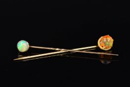 TWO OPAL STICKPINS, the first claw set with a spherical fire jelly opal, the second collet set