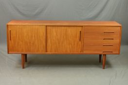 NILS JONSSON FOR TROEDS MODEL TRENTO, a Teak sideboard with double sliding doors, revealing a