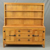 DEREK 'LIZARDMAN' SLATER, an oak dresser, the top with a two tier plate rack, the base with an