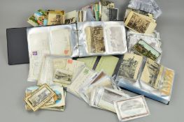 A QUANTITY OF POSTCARDS, loose and loosely inserted in two albums, Edwardian to late 20th Century