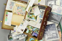 AN ACCUMULATION OF STAMPS, COVERS AND POSTCARDS, in two albums and loose