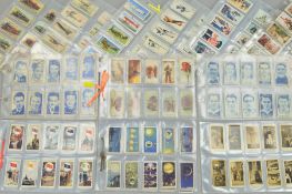 A LARGE COLLECTION OF CIGARETTE CARDS, loosely inserted in plastic sleeves, featuring