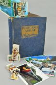 A POSTCARD ALBUM, loosely inserted, to include early to mid 20th Century British topographical,