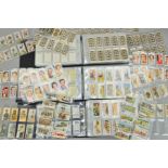 A JOHN PLAYER CIGARETTE CARD COLLECTION, in three ring binder albums featuring subjects including