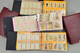 A CIGARETTE AND TRADE CARD COLLECTION, in three ring binder albums featuring history, military and